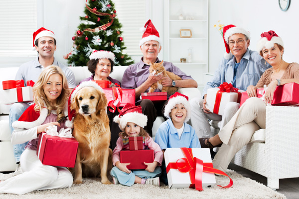 Family celebrating Christmas with dogs