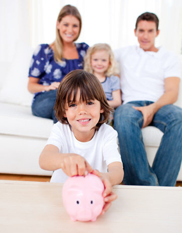 Family saving money into piggy bank
