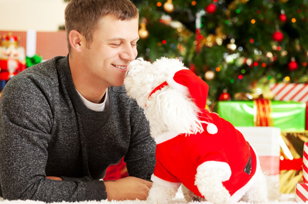 Man with rescued dog on Christmas