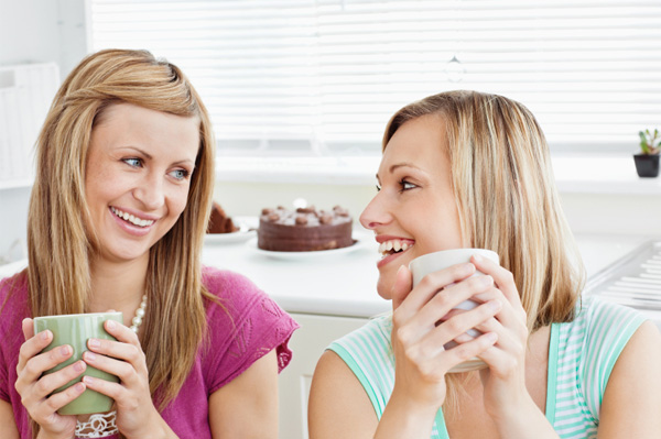 Relaxed party host chatting with friend