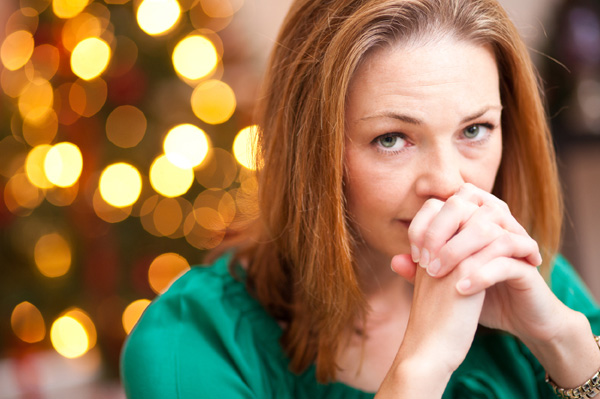 Depressed woman at holiday table