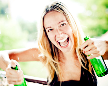 Woman double fisting beer