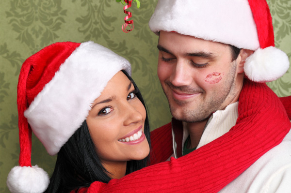 woman-kissing-man-under-mistletoe.jpg