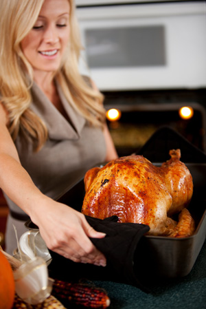 Woman roasting turkey