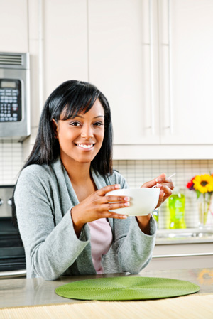 Woman starting day with healthy breakfast