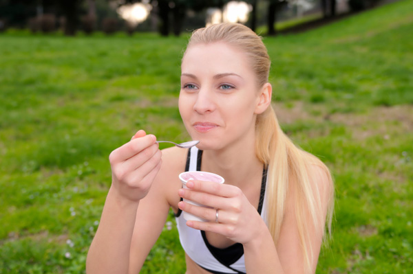 Woman eating yogurt