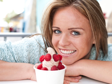Happy woman with frozen yogurt