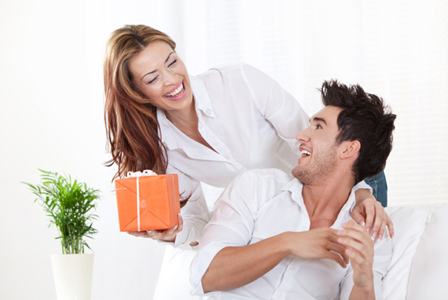 Woman giving boyfriend gift