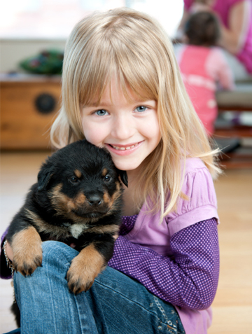 Little girl with puppy