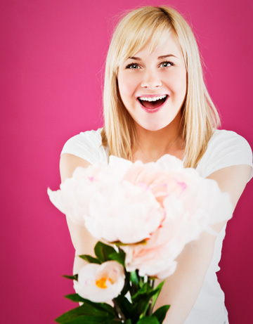 Single woman with flowers on Valentine's Day
