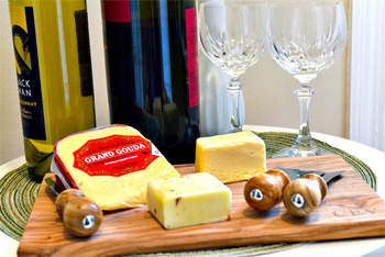 Wine and cheese on cutting board