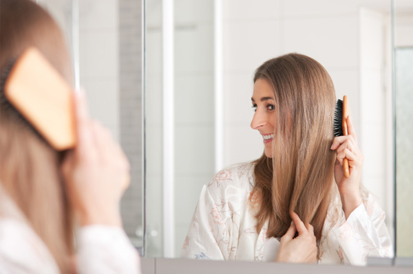 Woman caring for her dry and damaged hair