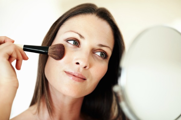 Woman applying makeup