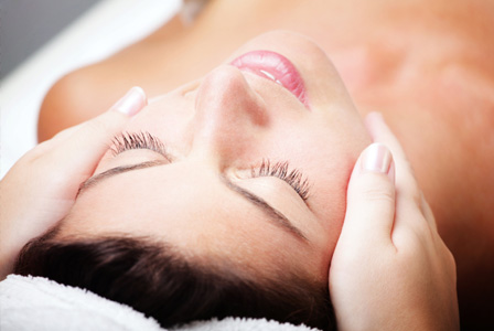 Woman getting face massage