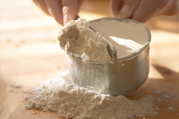 Woman baking with flour