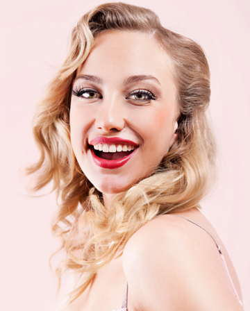 Woman with wavy hair styled with curling iron