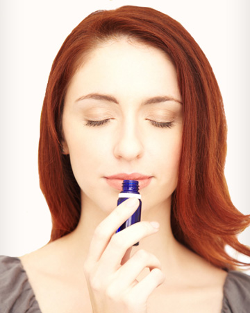 Woman smelling essential oils