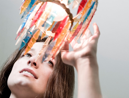 Woman touching chandelier