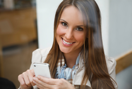 Woman using iPhone to plan date