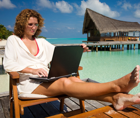 Woman working from beach
