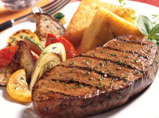 Grilled pepper steak with honey braised onions