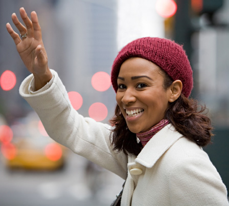 Woman hailing a cab in New York City