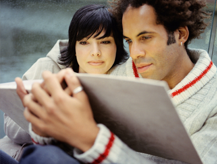 Couple looking at photo book
