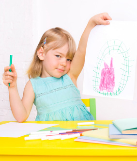 Little girl holding art