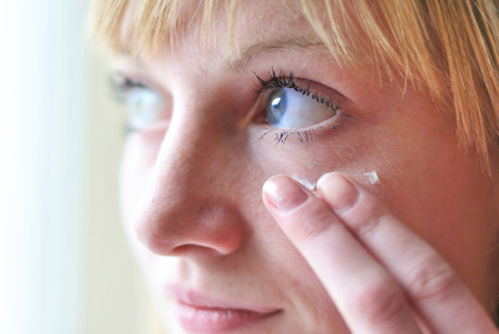 Mom applying eye cream