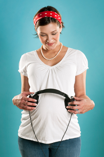pregnant woman with headphones