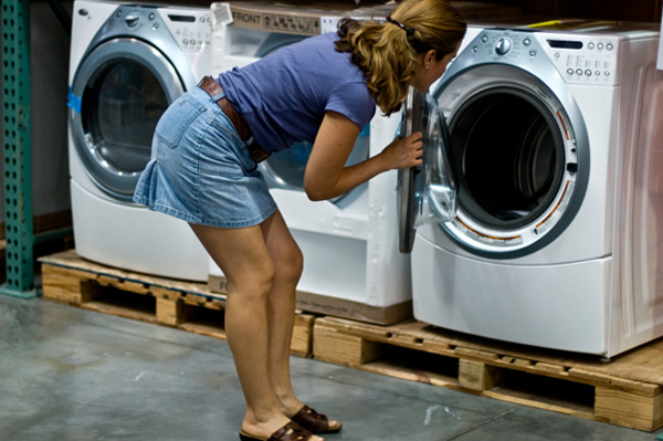 woman looking at different dryers