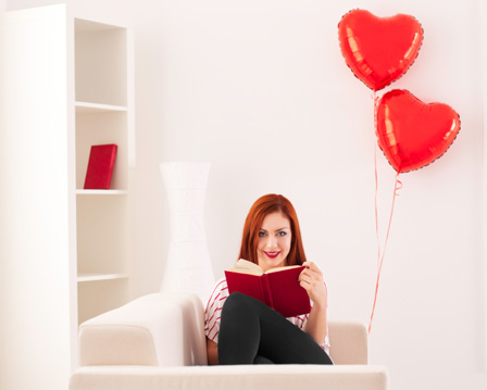 Woman reading book on Valentine's day
