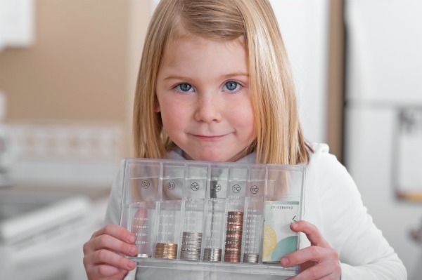 Little girl saving allowance