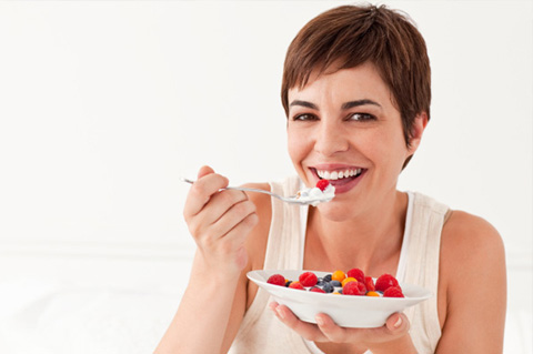Woman eating yogurt