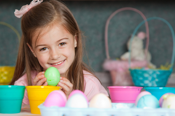 girl dying easter eggs