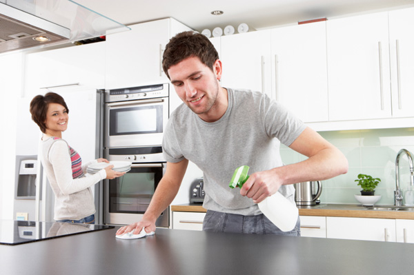 Man and woman cleaning with eco-friendly products