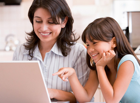 Mom shopping online with daughter