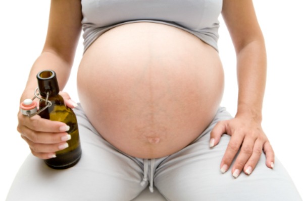 Pregnant woman drinking beer