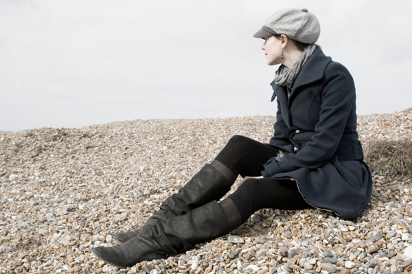 Winter woman wearing boots and a coat