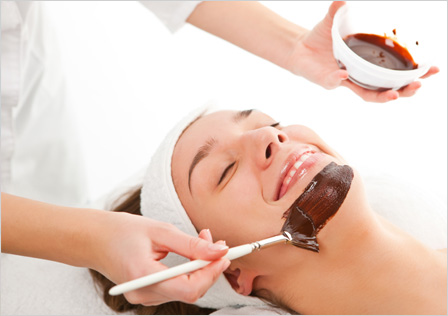 Woman getting chocolate facial