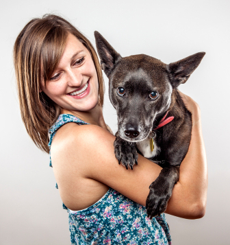 Woman holding rescue dog