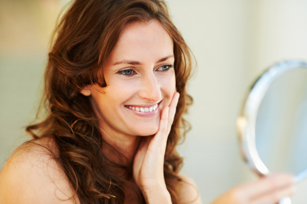 Woman looking in mirror