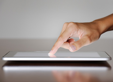 Woman touching iPad