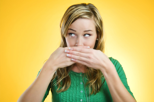 woman hiding bad breath