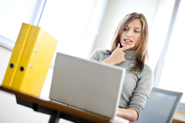 Woman looking at online dating site