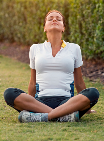 woman doing yoga outside