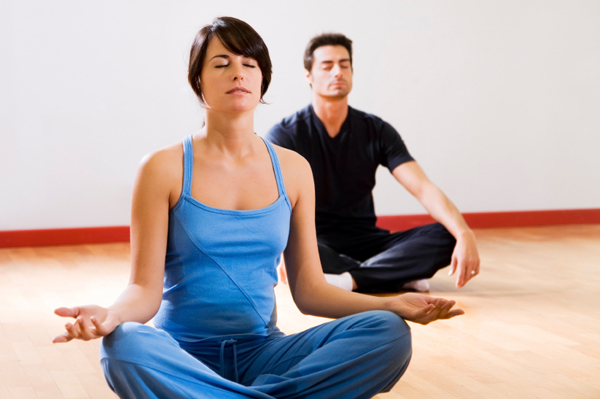Couple doing yoga