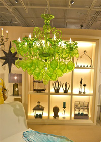 Green chandelier displayed at Cyan Design.