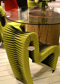 The Phillips Collection’s Seatbelt Chairs that appeared in movie The Hunger Games spotted in a vibrant citrus shade.