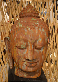 Aged patina medal creates a stunning Buddha head sculpture.